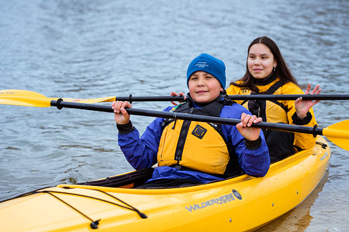 Indigenous family going kayaking