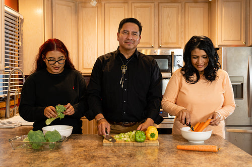 Indigenous family making a meal together