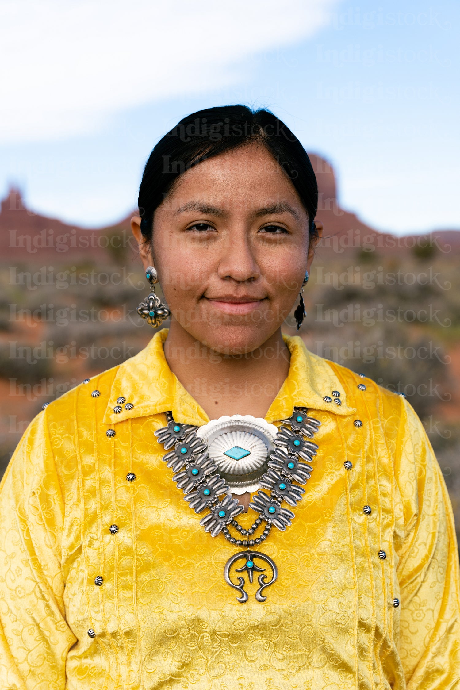 Young Native youth wearing traditional clothing and regalia outs