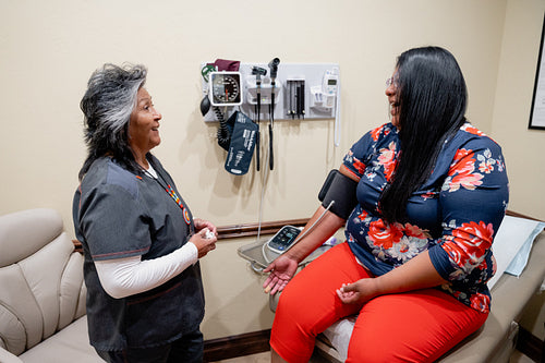 A native woman getting checked by an indigenous nurse