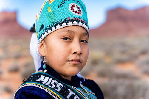 Native youth wearing traditional clothing and regalia