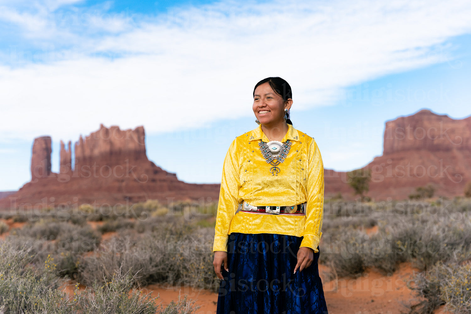 Young Native youth wearing traditional clothing and regalia outs