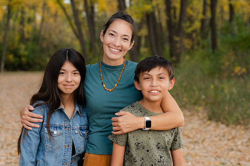 Indigenous family taking a walk in the woods