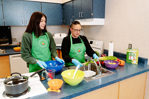 Indigenous Peoples making a meal together