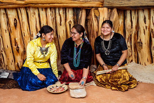 Native Women grinding corn