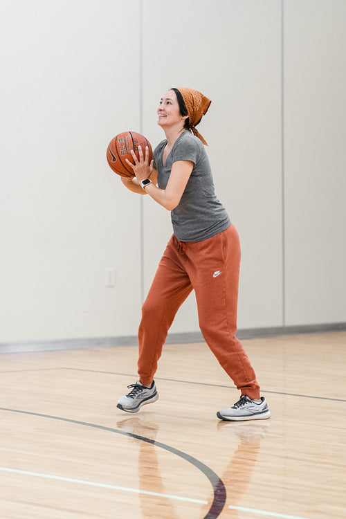 Native woman playing basketball