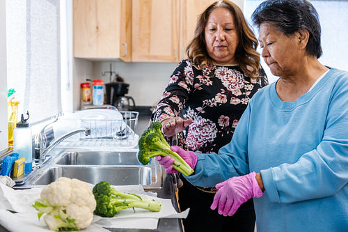 Native Peoples participating in a cooking class