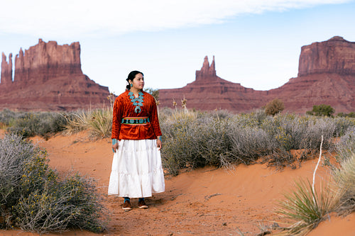 Young Native youth wearing traditional clothing and regalia outs