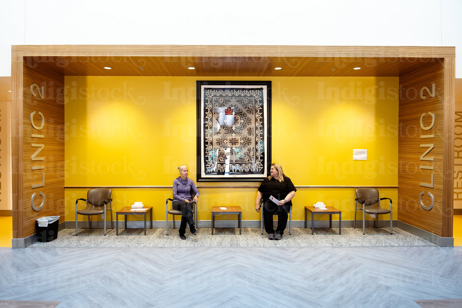 Two women waiting at a health clinic 