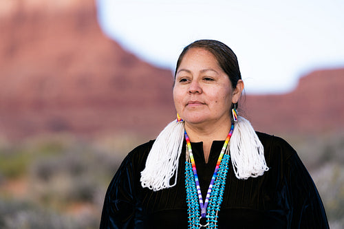 A Native woman wearing traditional regalia