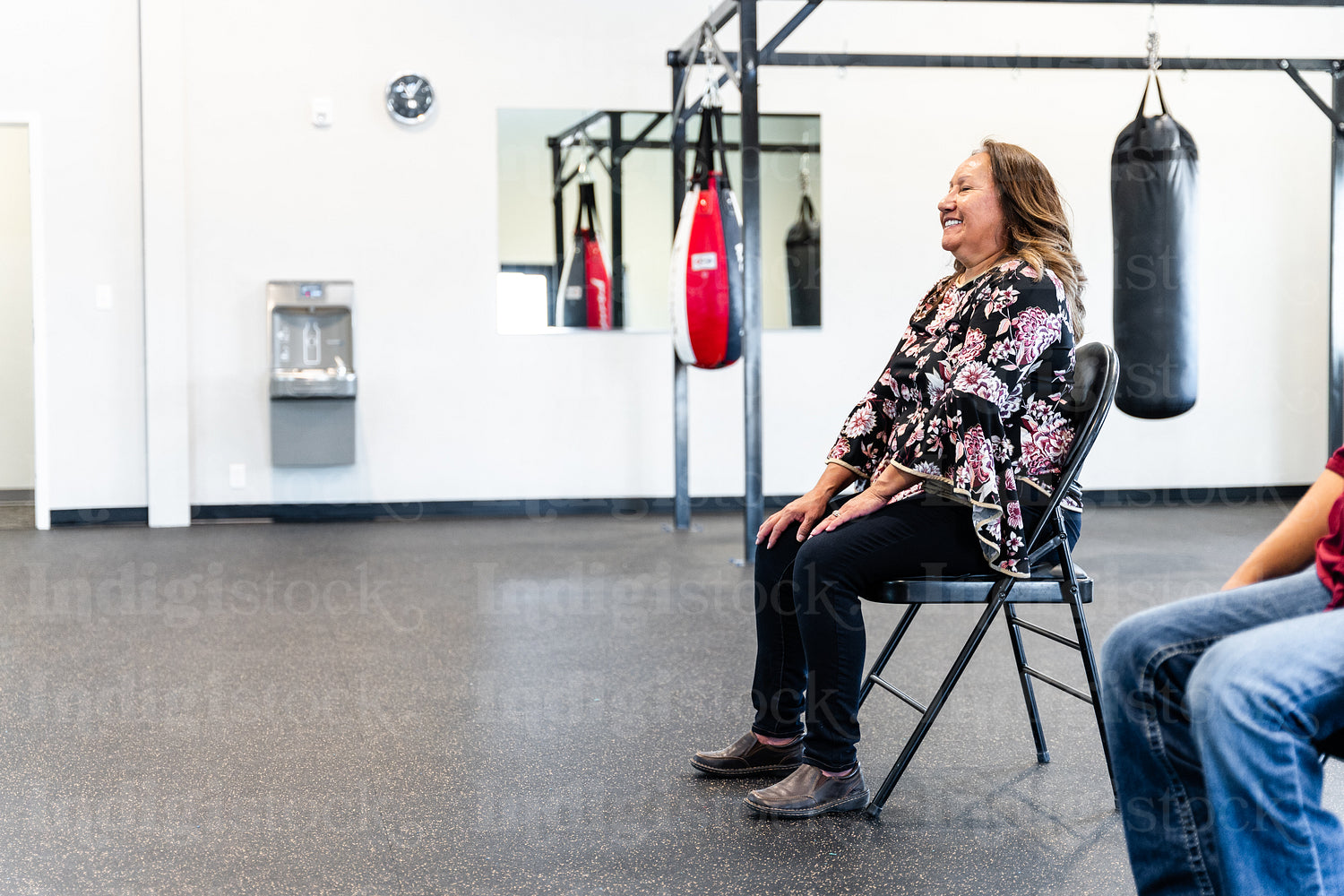 Native woman learning from an instructor 