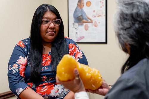 A native woman getting checked by an indigenous nurse