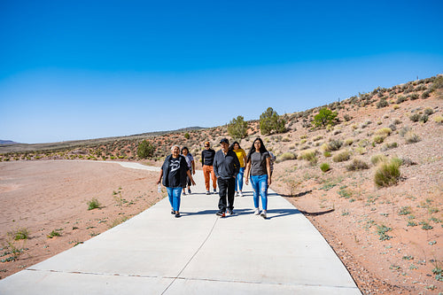 A Native family walking together