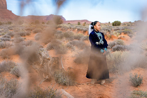 Native youth wearing traditional clothing and regalia