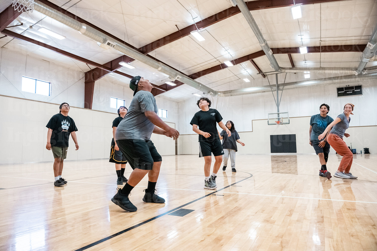 A Native family playing a game of basketball 