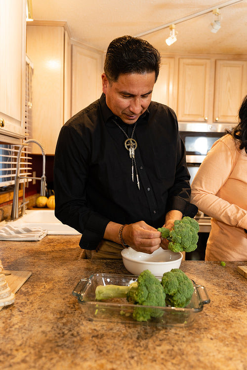 Indigenous family making a meal together