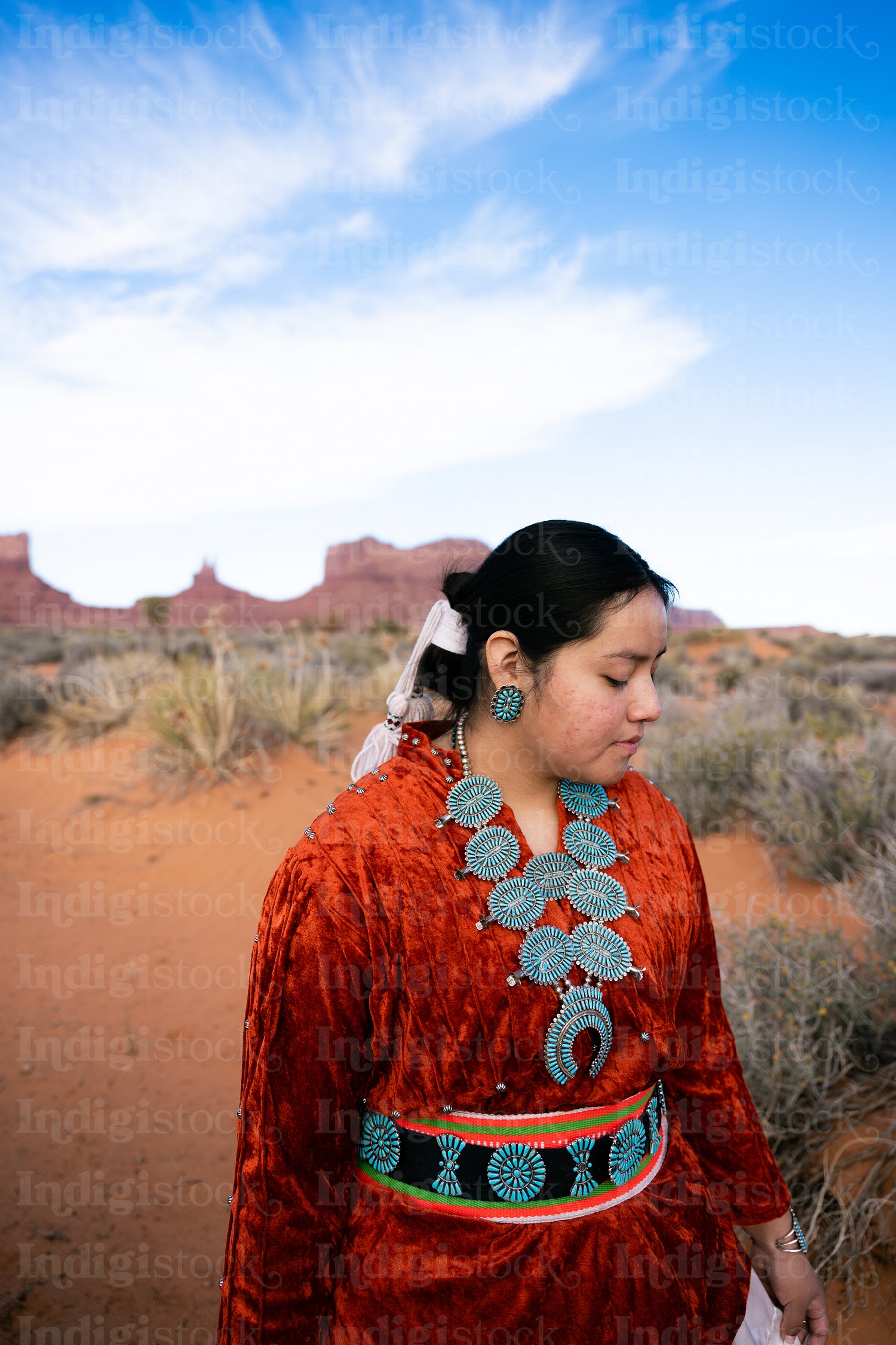 Young Native youth wearing traditional clothing and regalia outs