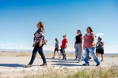 A Native family going on a walk outside