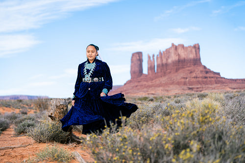 Native youth wearing traditional clothing and regalia