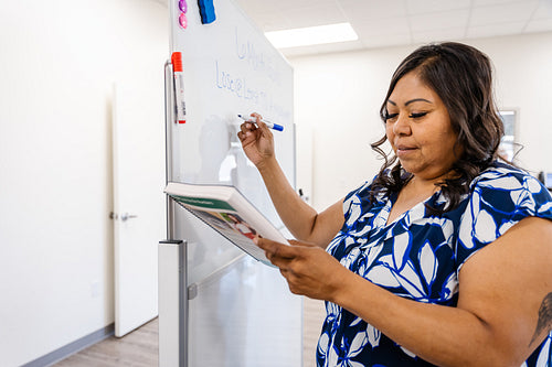 A native teacher instructing a class about health and wellness