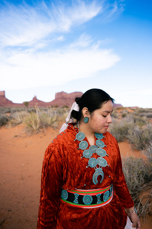 Young Native youth wearing traditional clothing and regalia outs