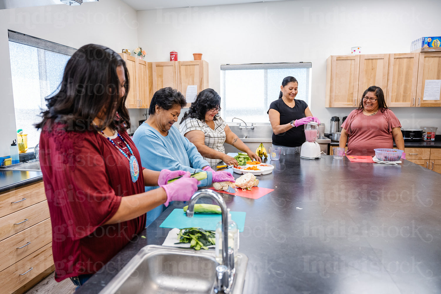 Native Peoples participating in a cooking class