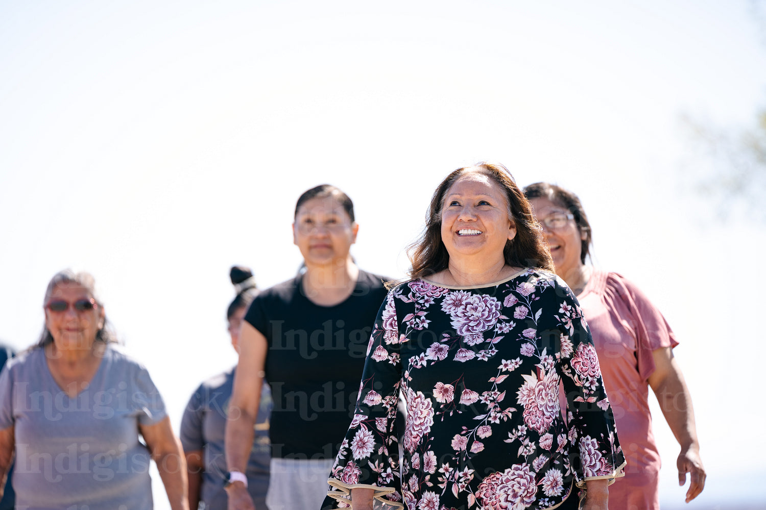 A Native family going on a walk outside 