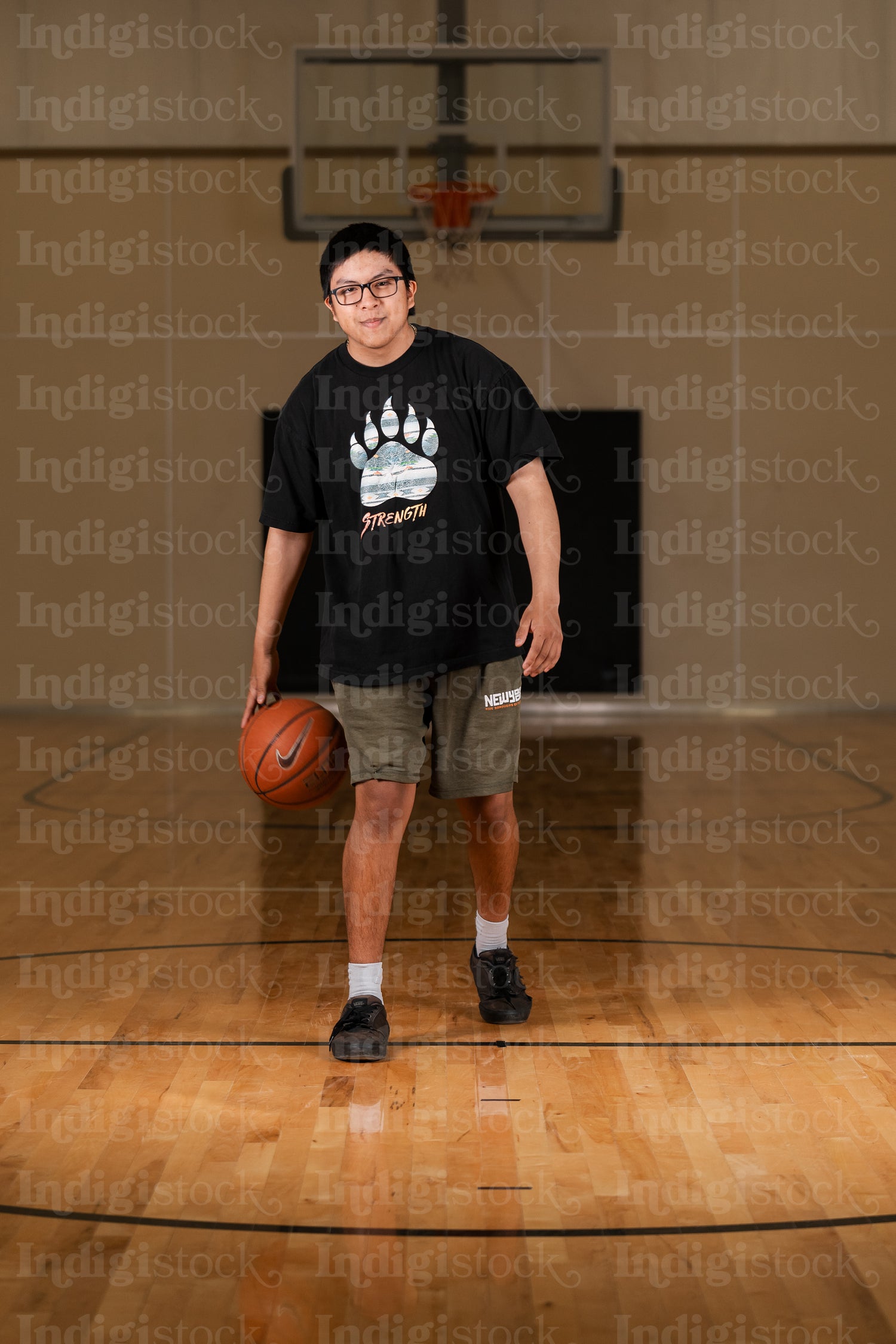 Native youth playing basketball