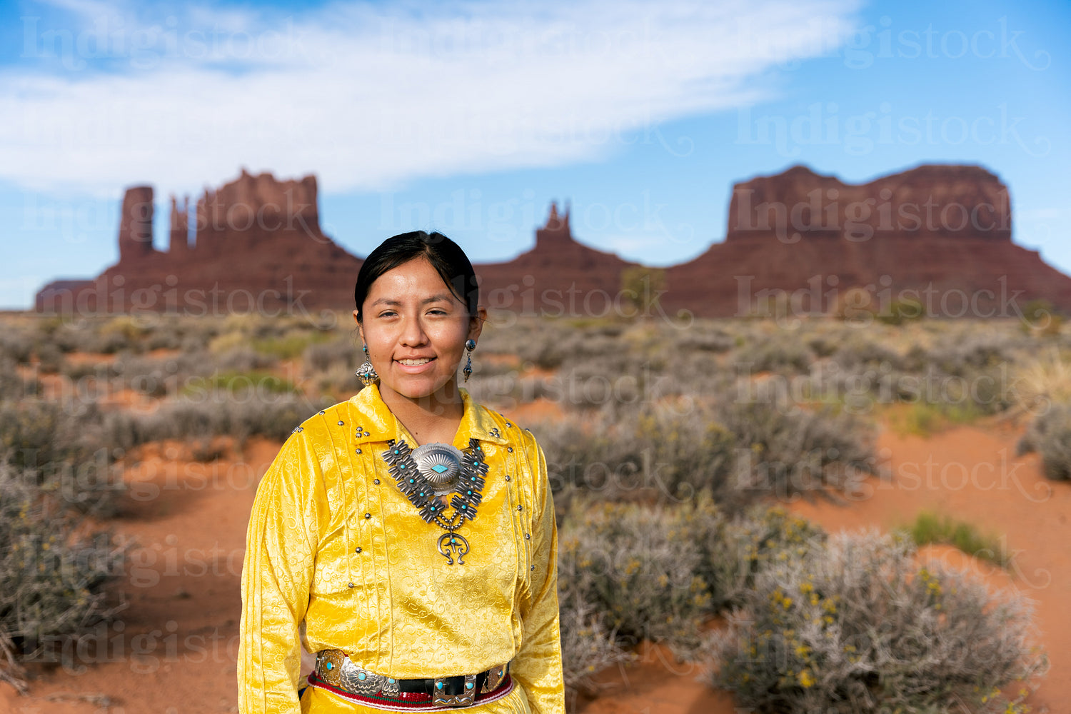 Young Native youth wearing traditional clothing and regalia outs