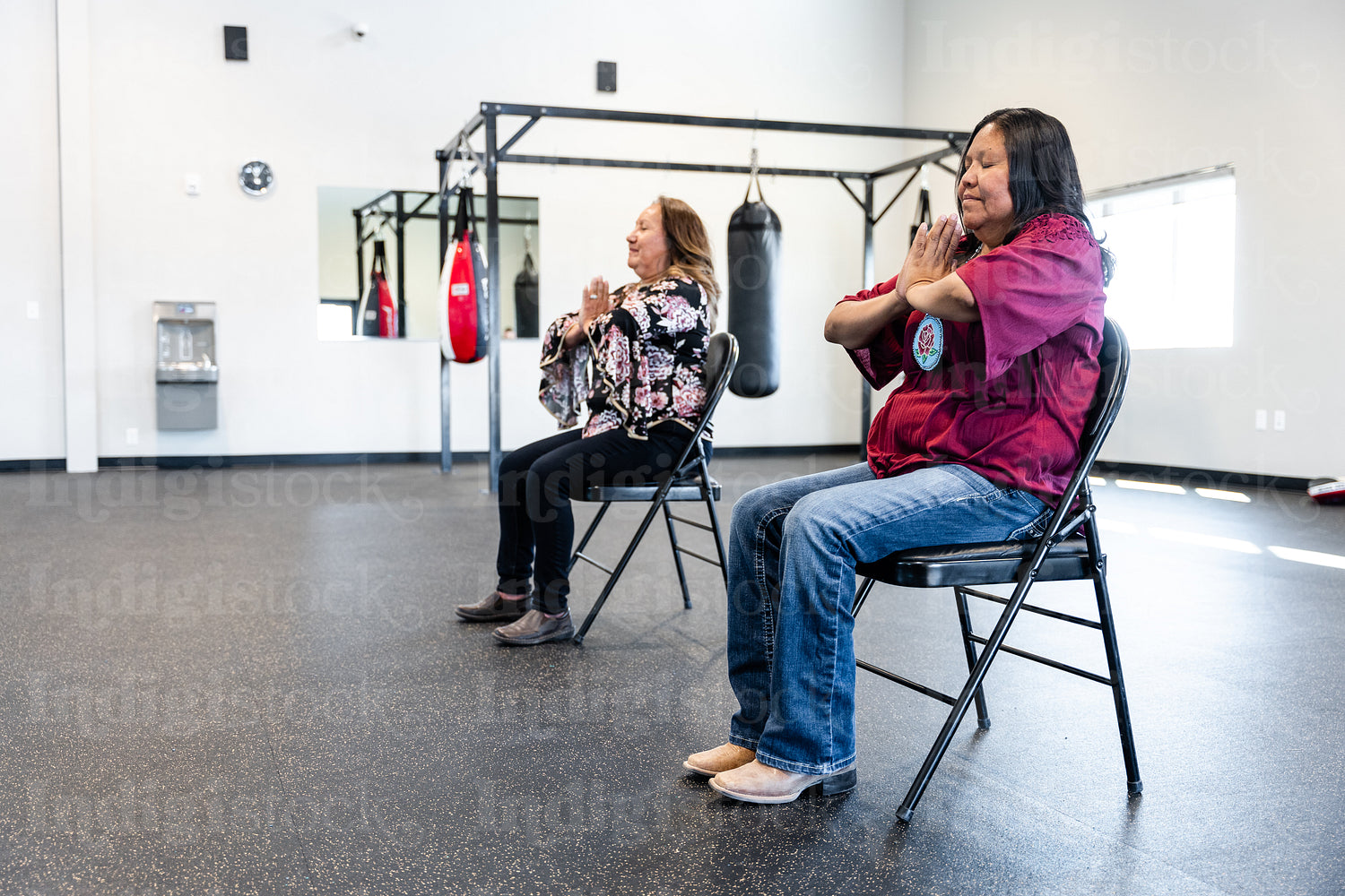 Native woman learning from an instructor 