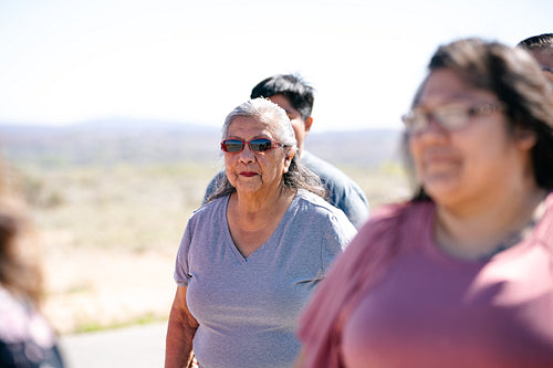 A Native family going on a walk outside