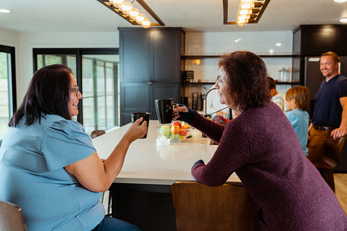 Two native women enjoying coffee together