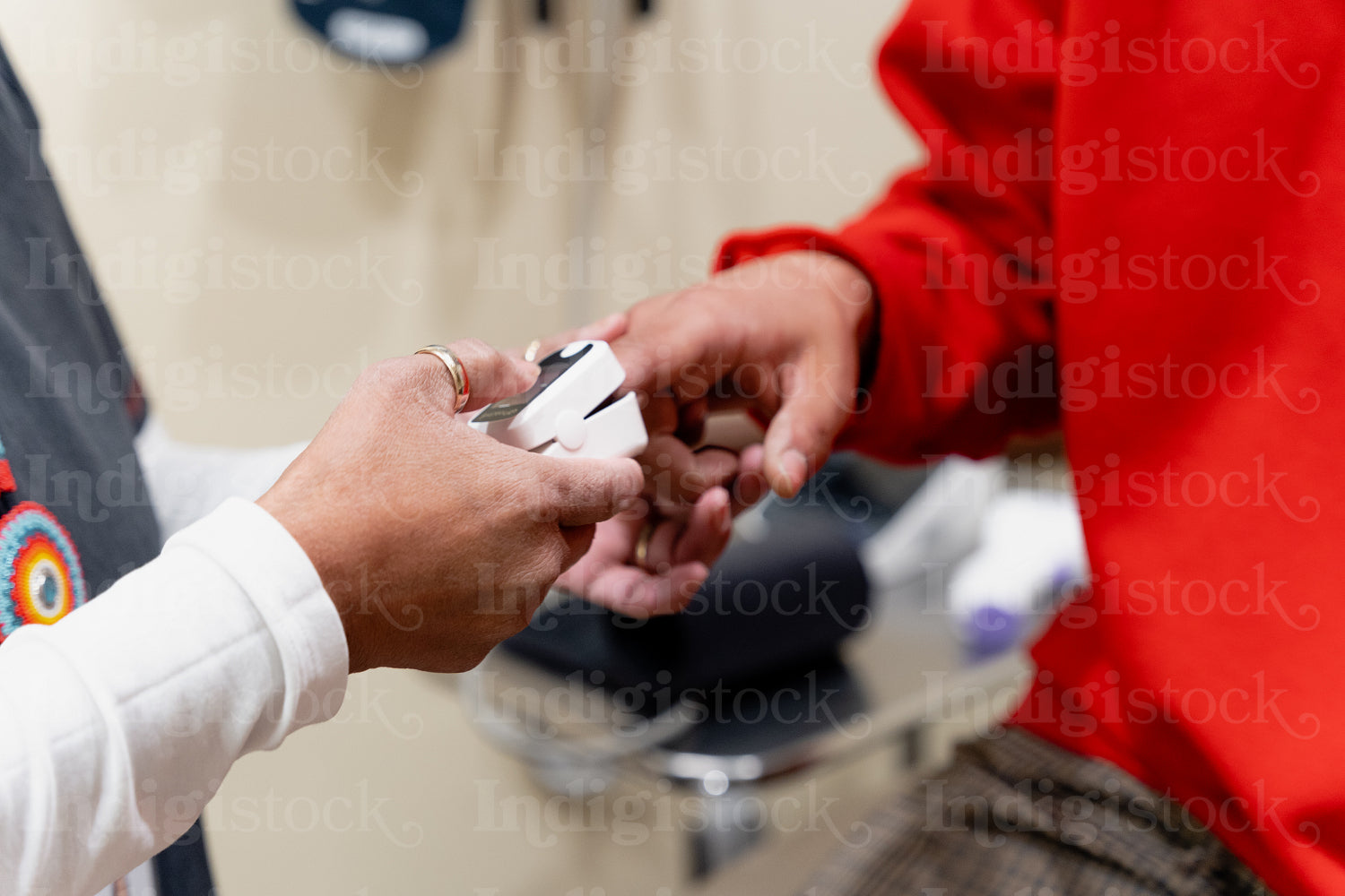 An Indigenous man being check by a native health care nurse