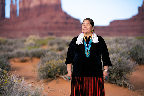 A Native woman wearing traditional regalia