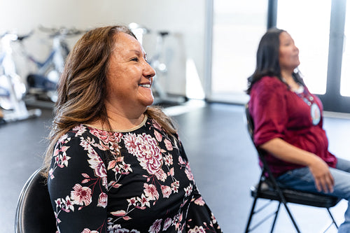 Native woman learning from an instructor