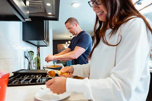 A couple cooking a meal together