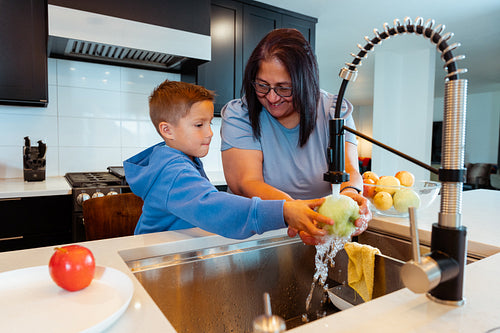 A Native family is preparing a meal together