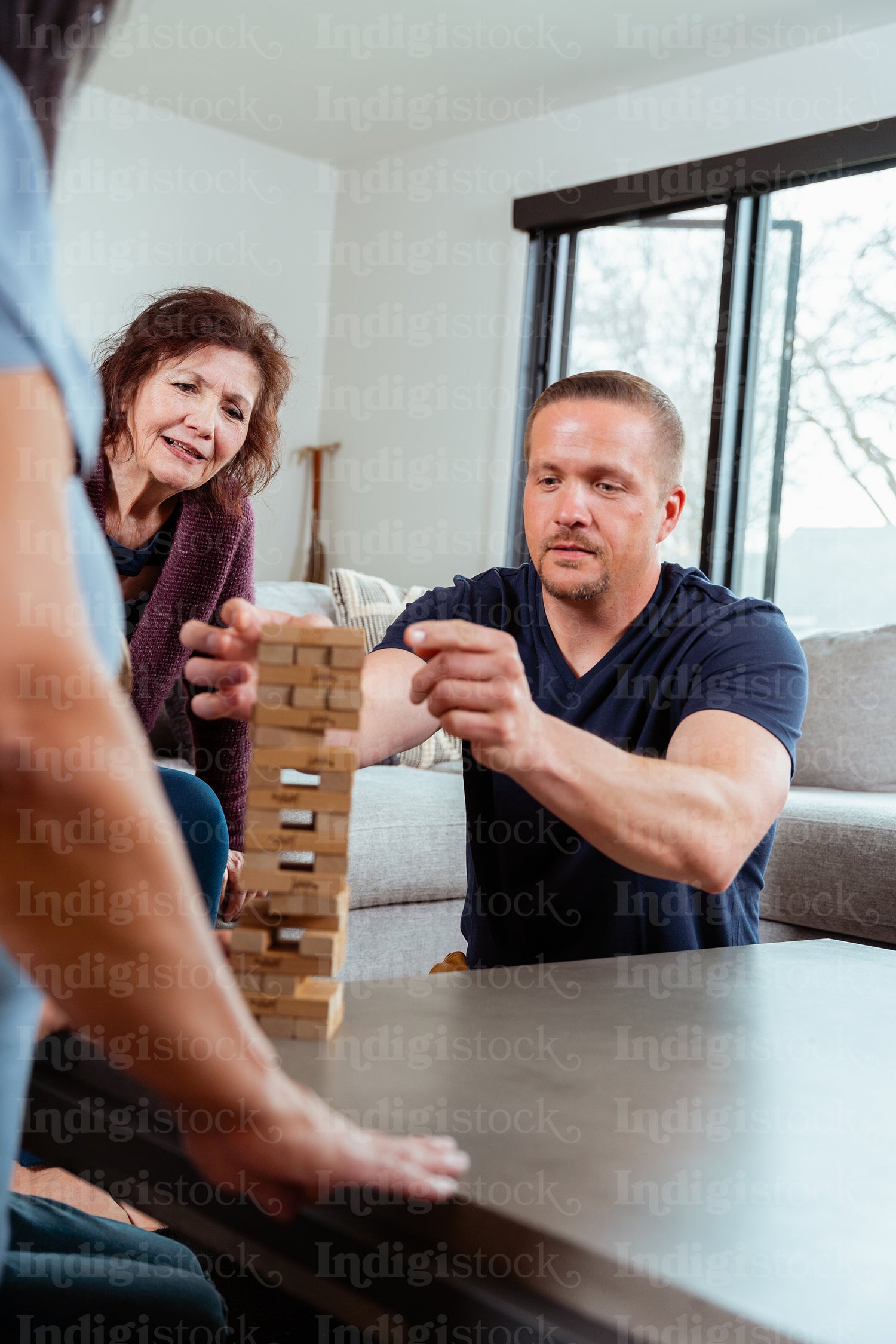 A family of Indigenous Peoples playing games together