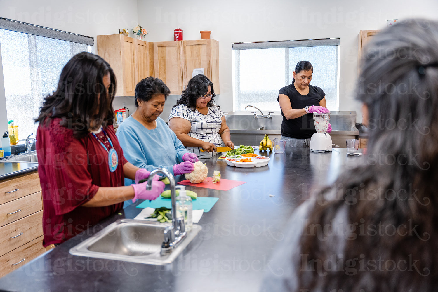 Native Peoples participating in a cooking class