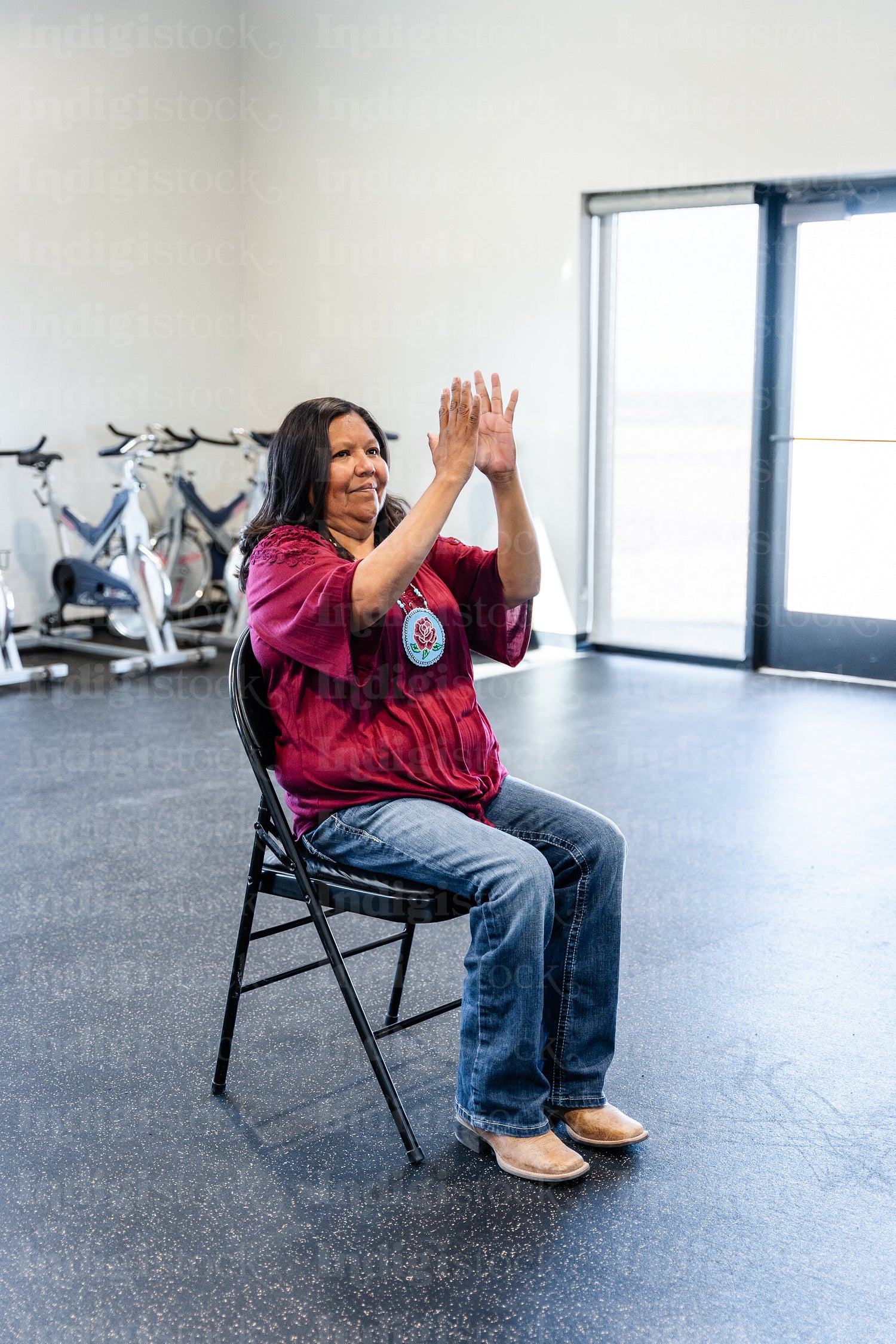 Native woman learning from an instructor 