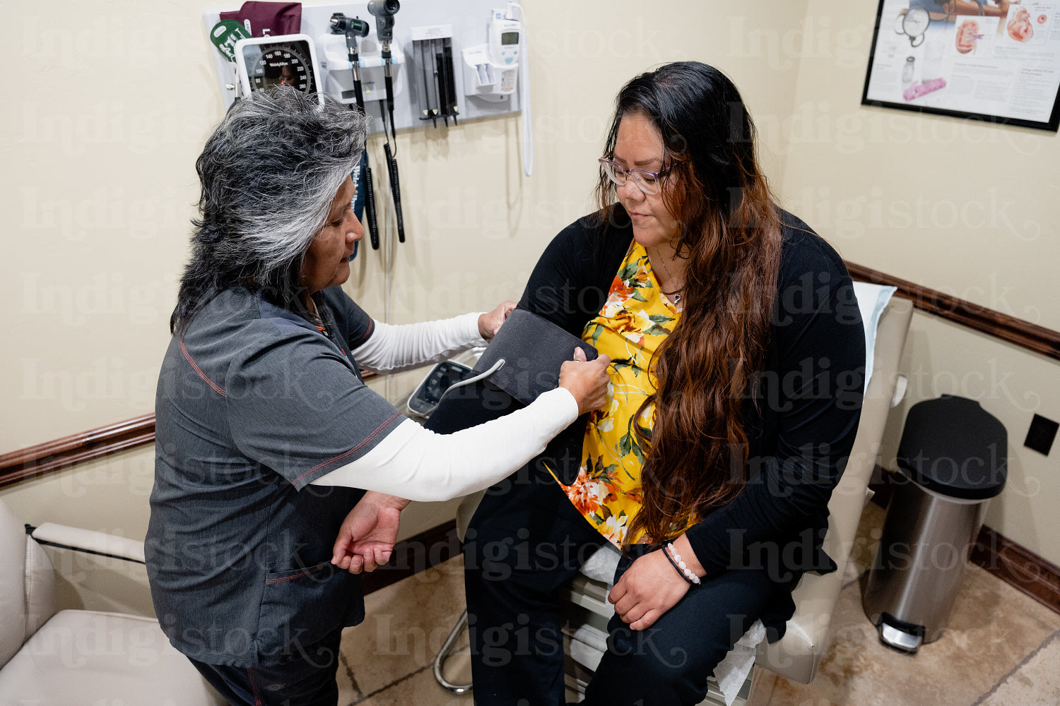 A native woman getting checked by an indigenous nurse 