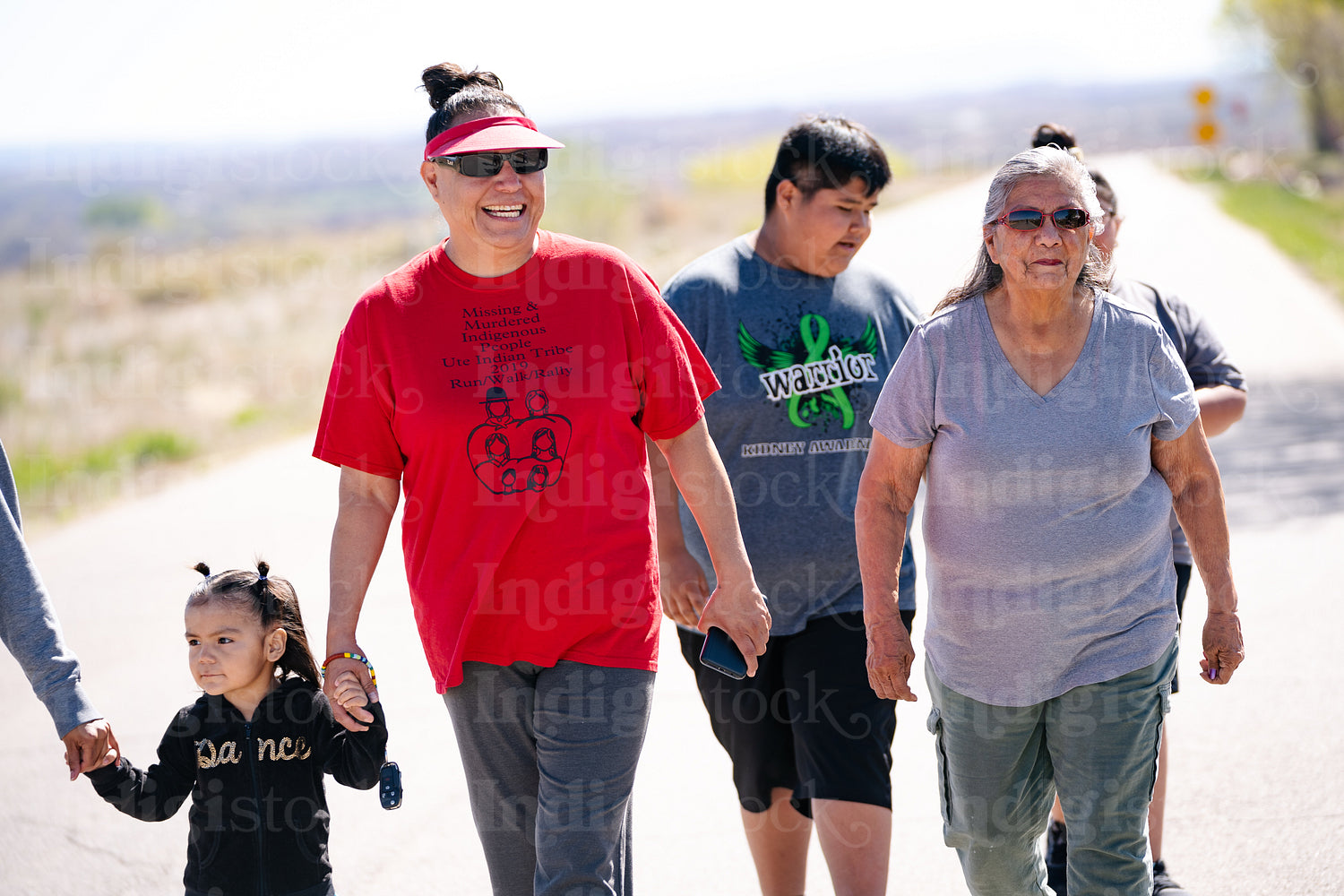 A Native family going on a walk outside 