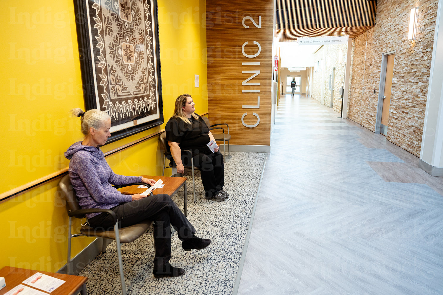 Two women waiting at a health clinic 