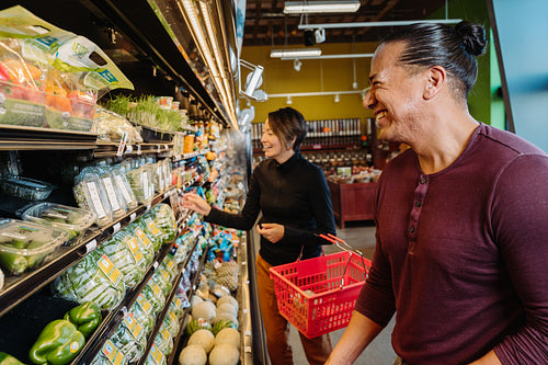 Indigenous couple grocery shopping