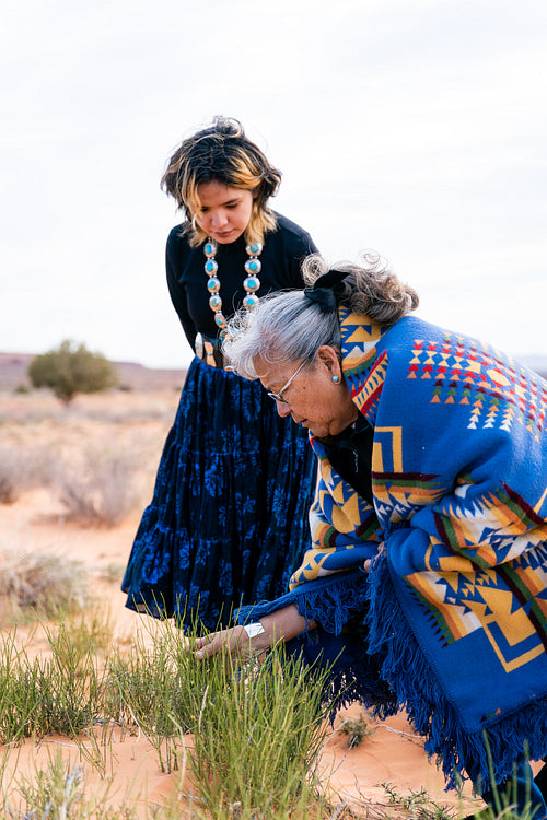 An indigenous elder with the younger generation wearing traditio