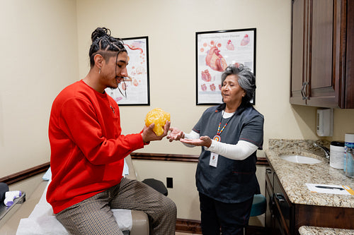 An Indigenous man being check by a native health care nurse