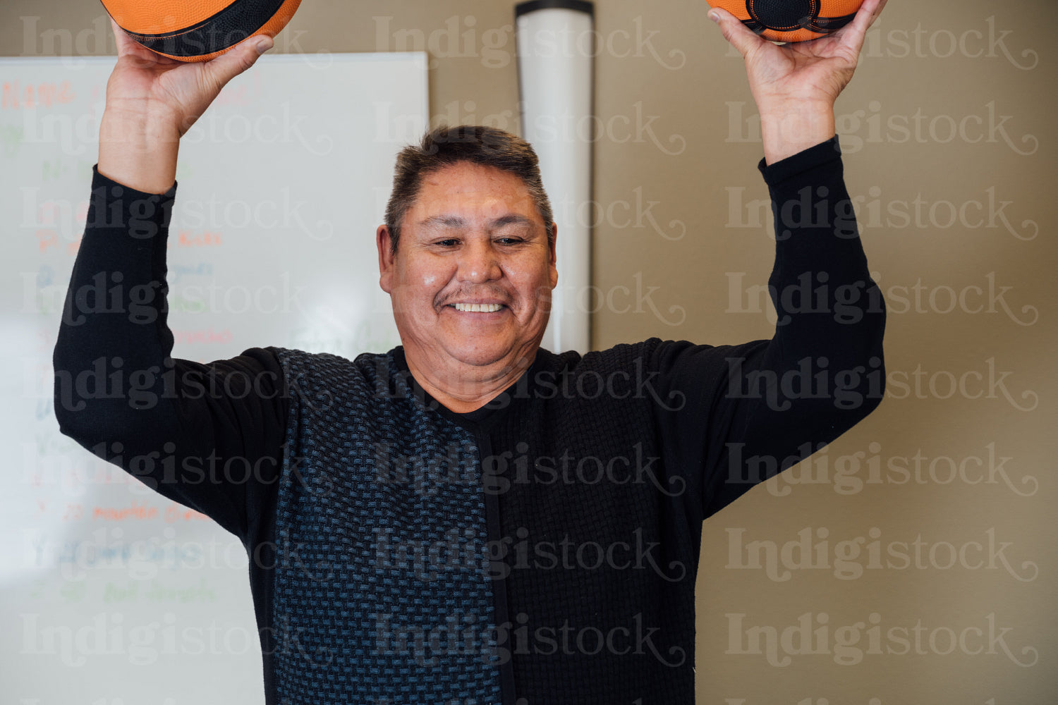 Indigenous man working out at the gym