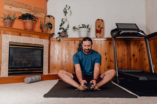 Indigenous Men working out in home gym