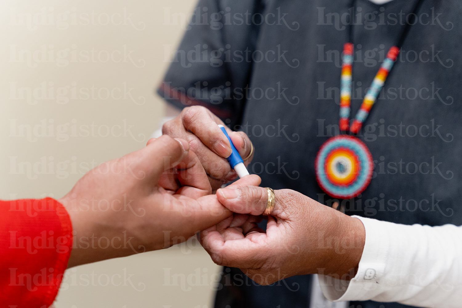 An Indigenous man being check by a native health care nurse