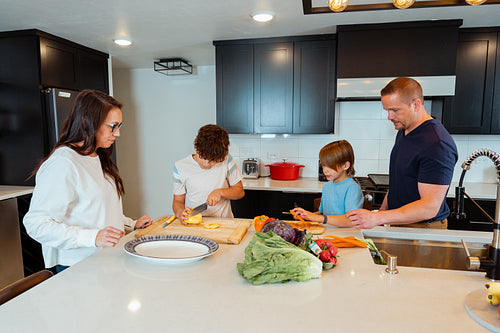 A Native family is preparing a meal together